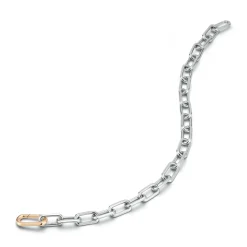 SAXON STERLING SILVER LINK BRACELET WITH 18K ROSE GOLD ELONGATED SPRING LOADED CLASP